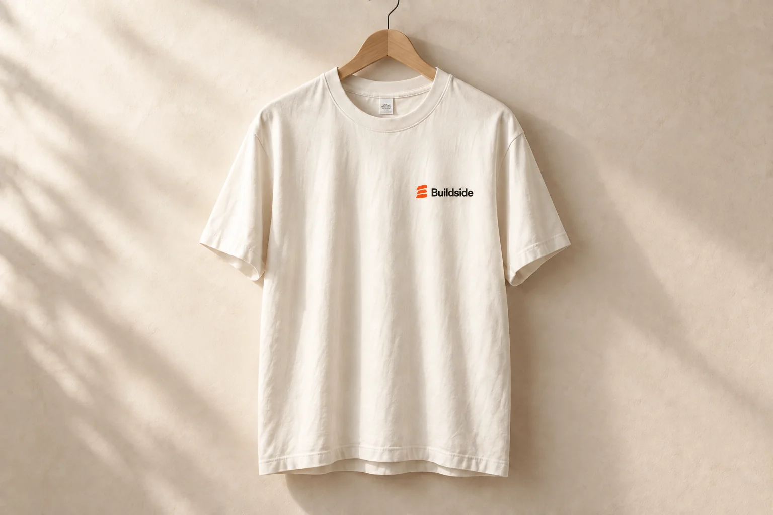 Natural-colored Buildside T-shirt with an orange and black chest logo